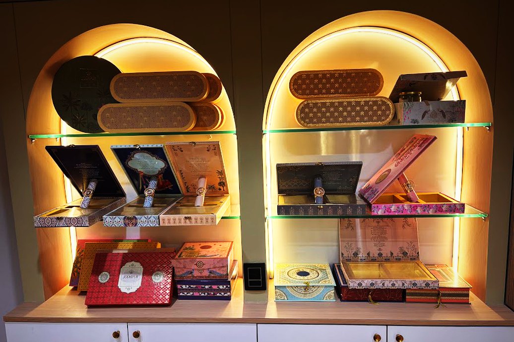 Lit arched niches above the display cases inside the shop