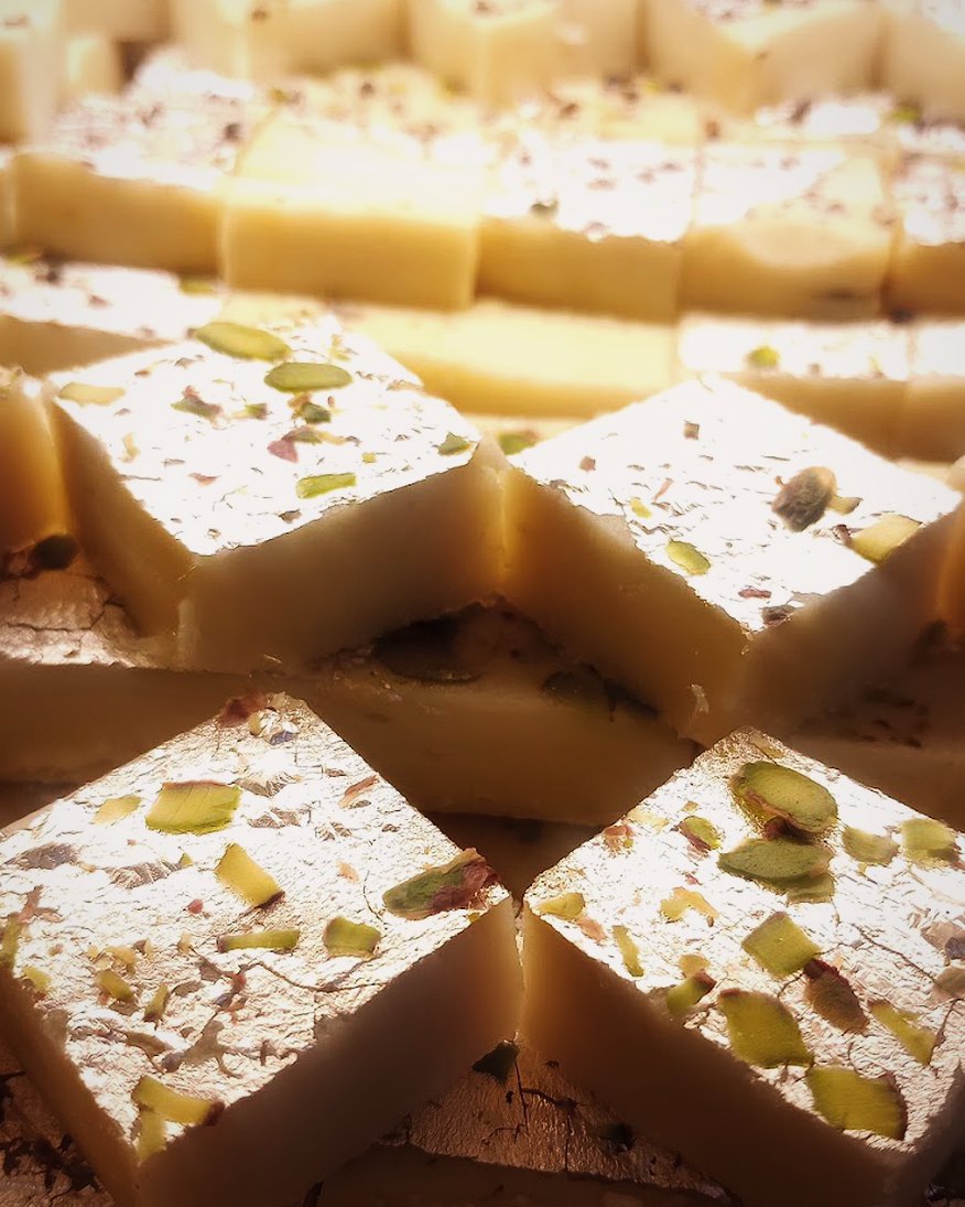 Trays of barfi and mithai in the display case